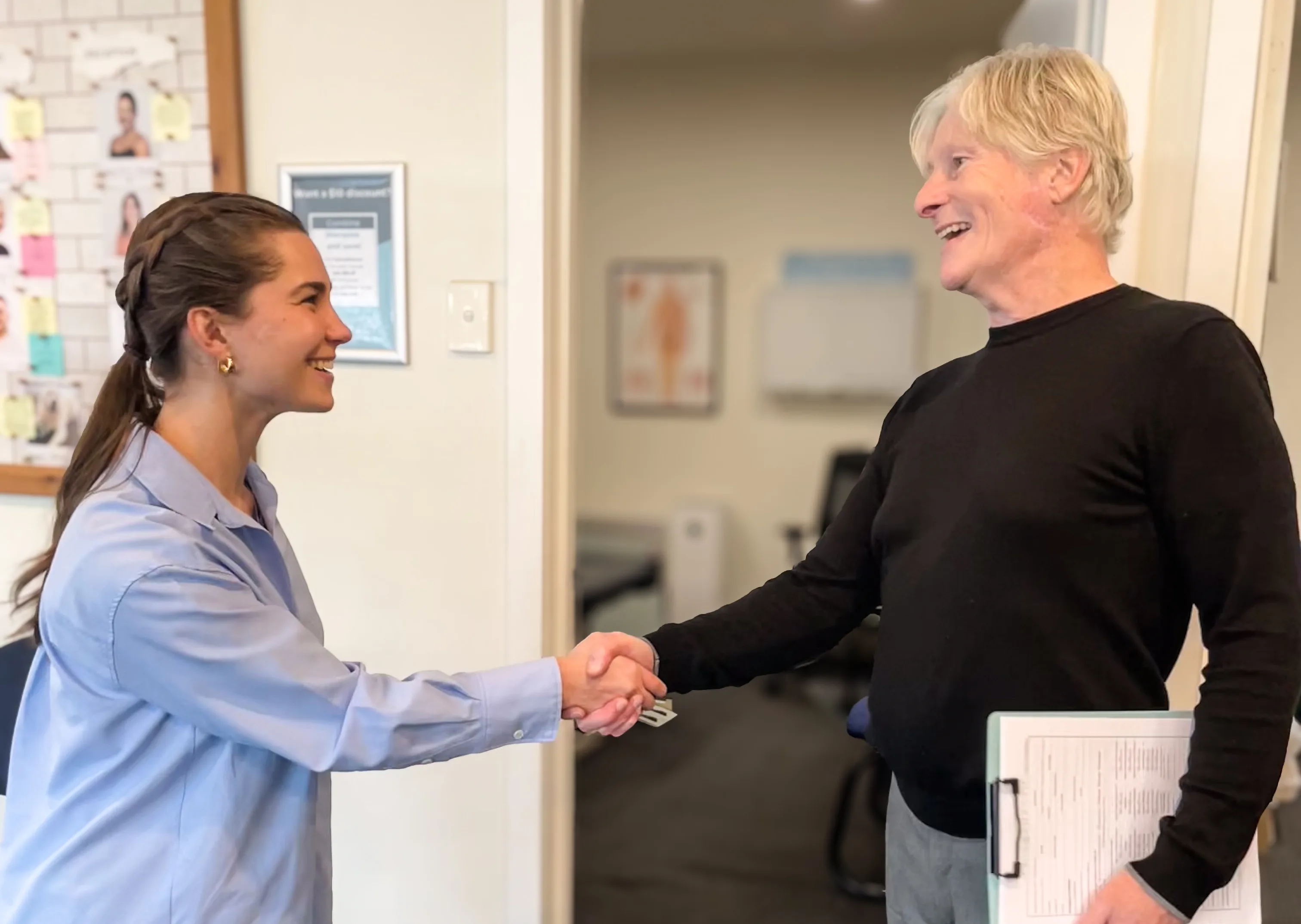Practitioner greeting a patient at Brunswick Chiropractic